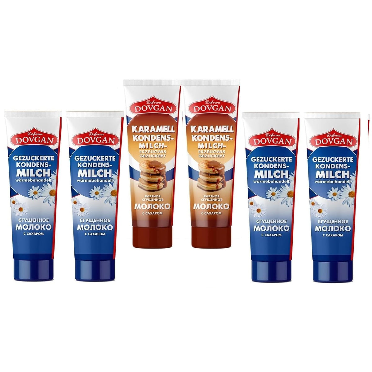 Sortiment Dovgan gezuckerte Kondensmilch in Tube, vier blaue Tuben traditionelle Milch und zwei braune Tuben Karamell, alle Tuben stehend frontal sichtbar.
