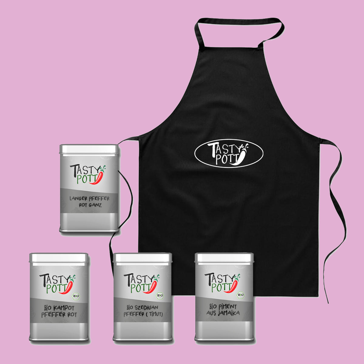 tasty pott pfeffer geschenkset mit vier gewürzdosen und schwarzer schürze, vor rosa hintergrund platziert