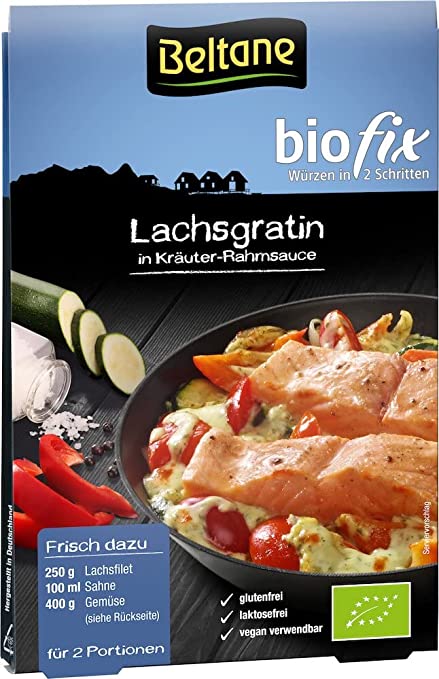 Beltane Bio Fix für Lachsgratin, 20g, in einer offenen Packung, mit frischen Lachsfilets und Gewürzen auf einem Küchenhintergrund