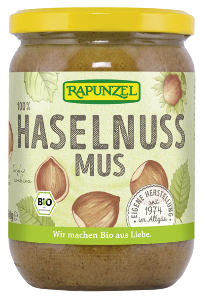 Bio Haselnussmus von Rapunzel in einem Glas, ideal für Frühstück, zeigt die cremige Haselnusscreme.