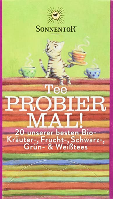 Bio Tee von Sonnentor, Probier Mal! Aufgussbeutel, 34,4g, mit frischen Kräutern in einer offenen Packung.