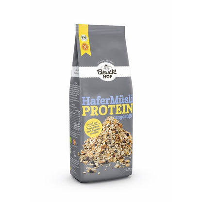 Bauckhof Hafer Müsli Protein glutenfrei 425g, stehende Packung frontal vor weißem Hintergrund, Müsli sichtbar am Boden der Verpackung.
