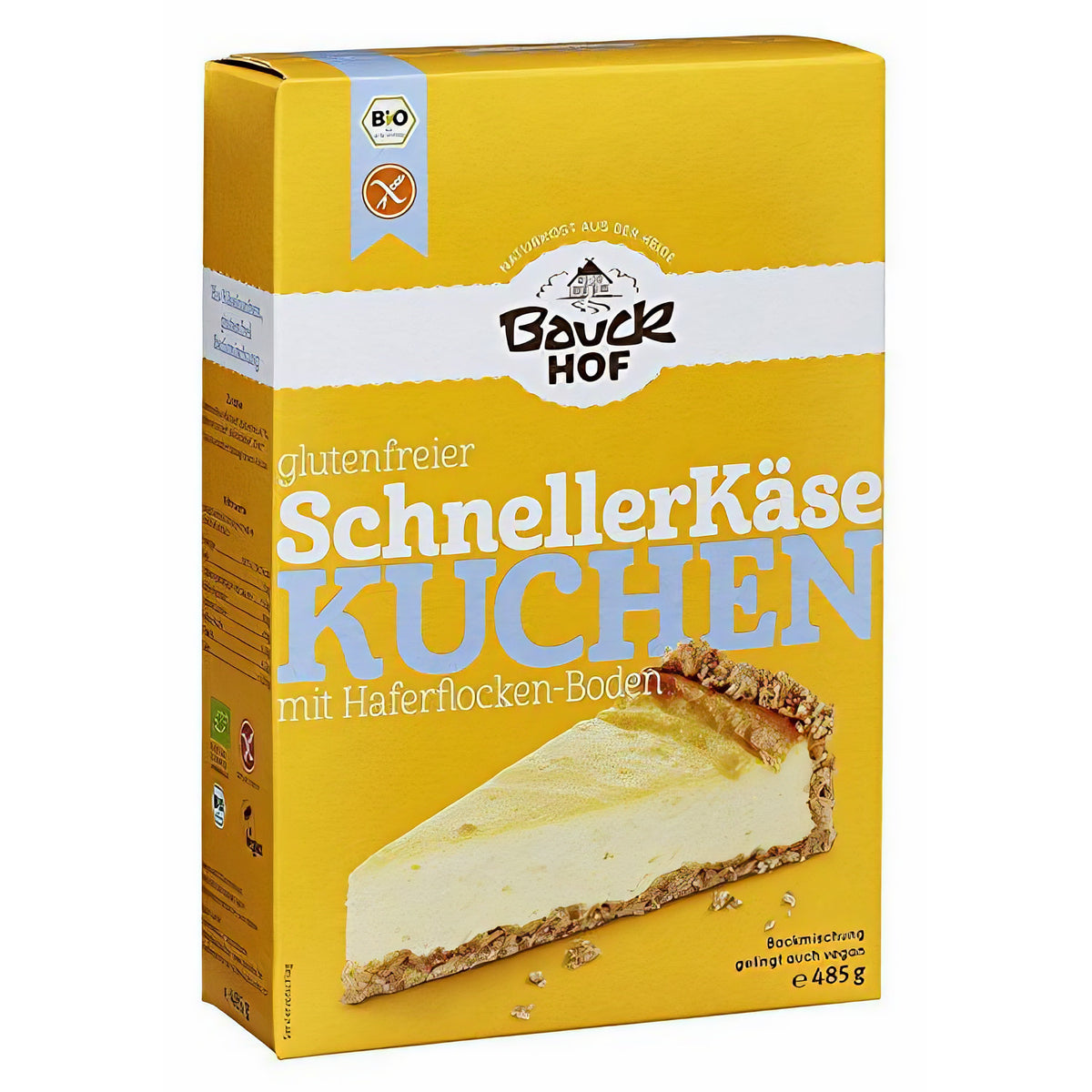 Bauckhof schnelle Käsekuchen Backmischung glutenfrei 485g, leicht von der Seite fotografiert, Verpackung mit großem Käsekuchenstück abgebildet.
