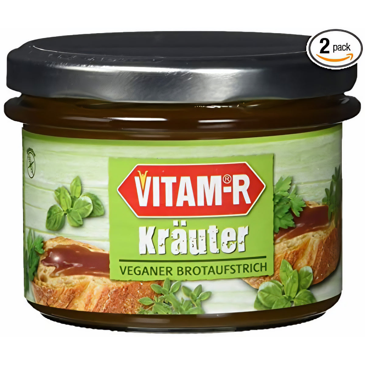 Nahaufnahme eines Glases VITAM-R Kräuter Hefeextrakt 2x250g mit grünem Etikett und silbernem Deckel, Produkt im Vordergrund.