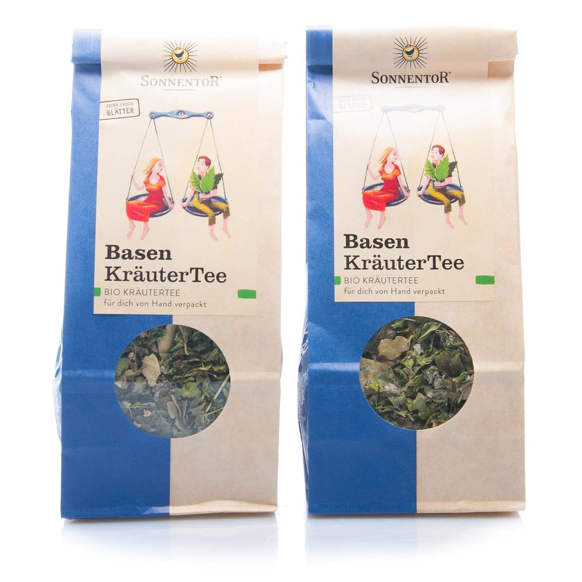 Zwei Packungen Sonnentor Basen Kräutertee lose 2x50g mit Sichtfenster nebeneinander vor weißem Hintergrund, Kräuterfüllung deutlich erkennbar.