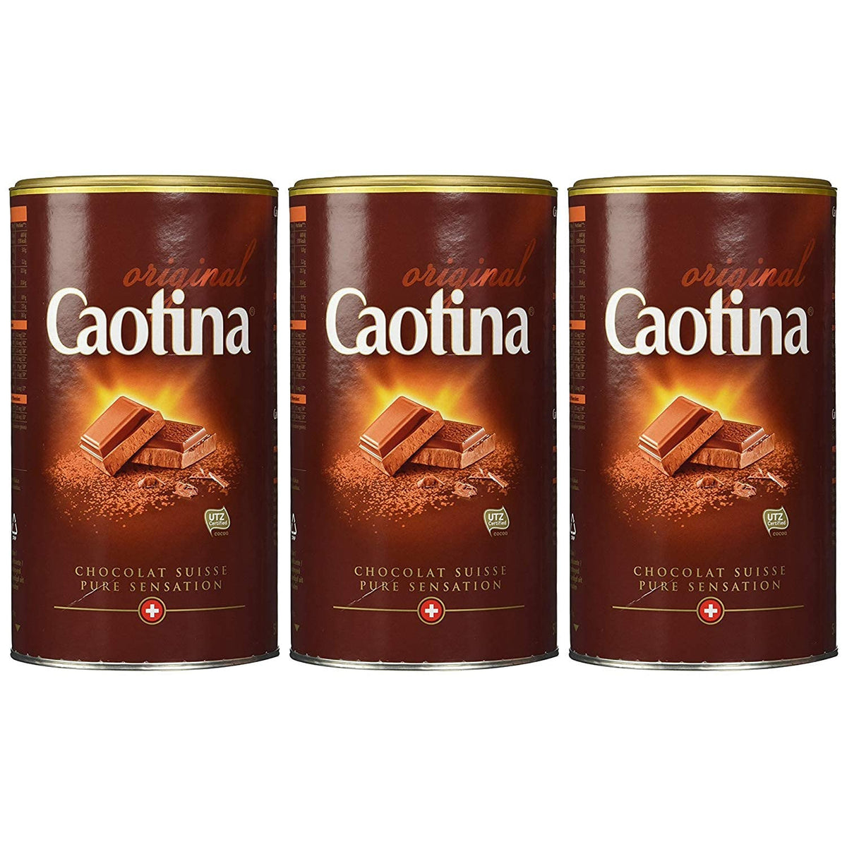 Drei Dosen Caotina Original Kakaopulver 500g nebeneinander vor weißem Hintergrund, alle Etiketten mit Schokoladenstücken nach vorne gerichtet.