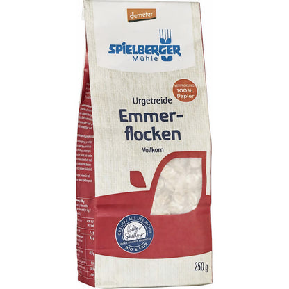 spielberger Emmerflocken demeter 250g Packung aus Papier, leicht seitlich fotografiert, Produktinformationen und Sichtfenster mit Flocken sichtbar