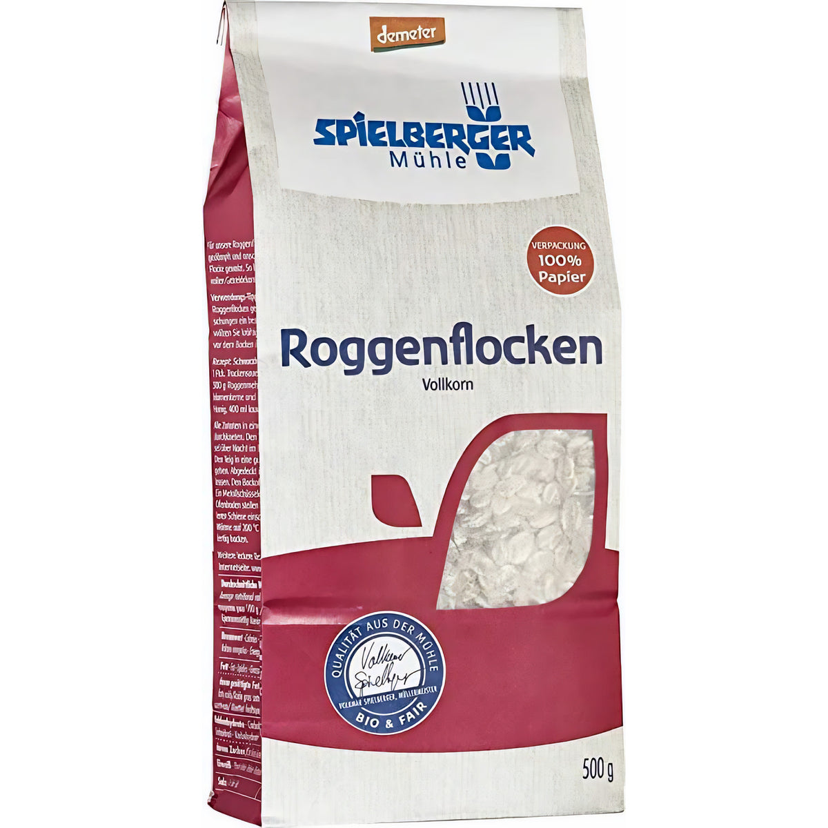 seitliche Ansicht der spielberger roggenflocken demeter 500g Packung, Verpackung aus Papier mit sichtbarem Sichtfenster und Produktinformationen