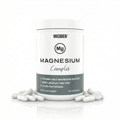 Weider Magnesium Complex Dose mit 120 Kapseln, einige weiße Kapseln liegen vor der Dose auf einer glänzenden Oberfläche.
