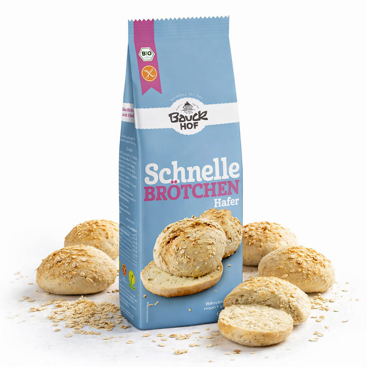 Bauckhof Backmischung Schnelle Brötchen Hafer 500g, Packung stehend, umgeben von gebackenen glutenfreien Brötchen mit Haferflocken bestreut.