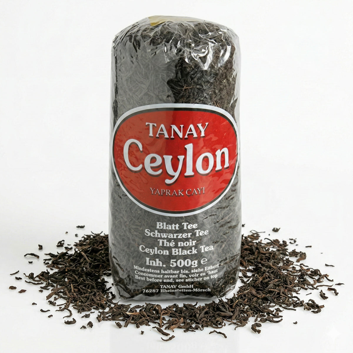 Schwarzer Tee Tanay Ceylon in 500g Packung, frisch und aromatisch, mit Teeblättern in einer offenen Packung.