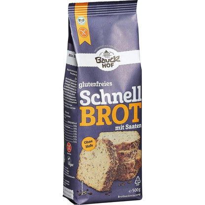 bauckhof schnellbrot backmischung glutenfrei 500g in lila verpackung, leicht seitliche ansicht, ohne weitere gegenstände oder brot im bild.
