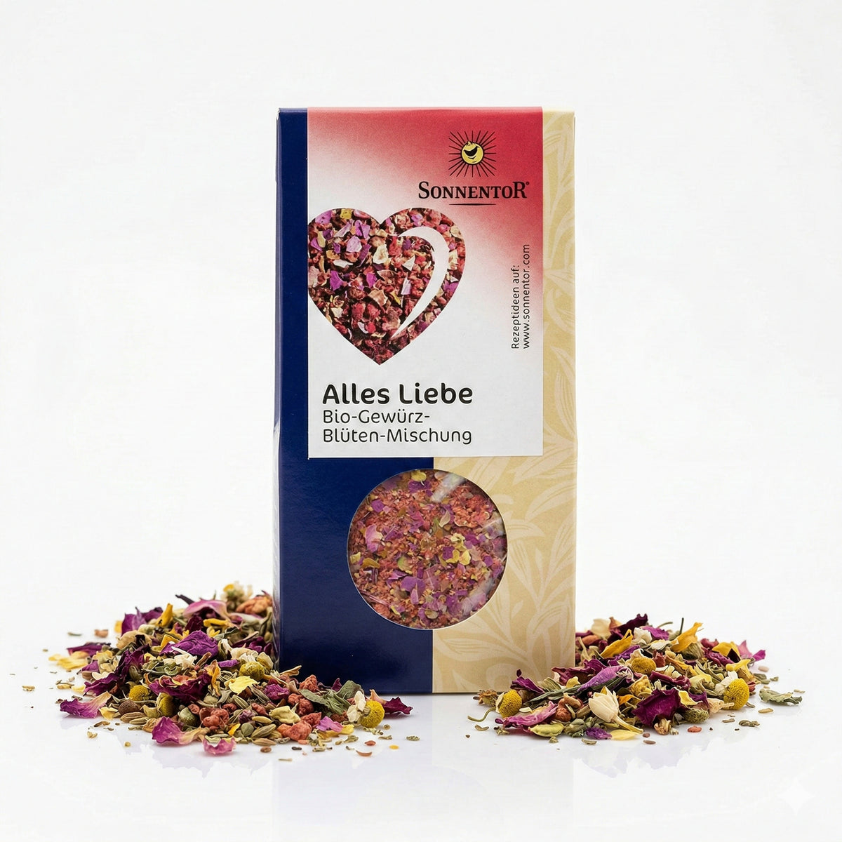 Sonnentor Alles Liebe Gewürz-Blüten-Mischung im 40g Pack, stehend vor weißem Hintergrund, umgeben von verstreuten Blüten und Gewürzen als Topping.
