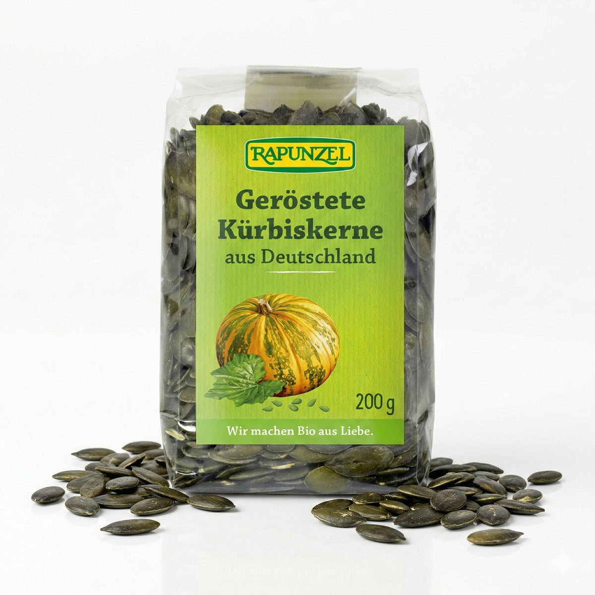 Geröstete Bio-Kürbiskerne von Rapunzel in 200g Packung, ideal zum Kochen und Snacken, mit grünen und braunen Kerne sichtbar