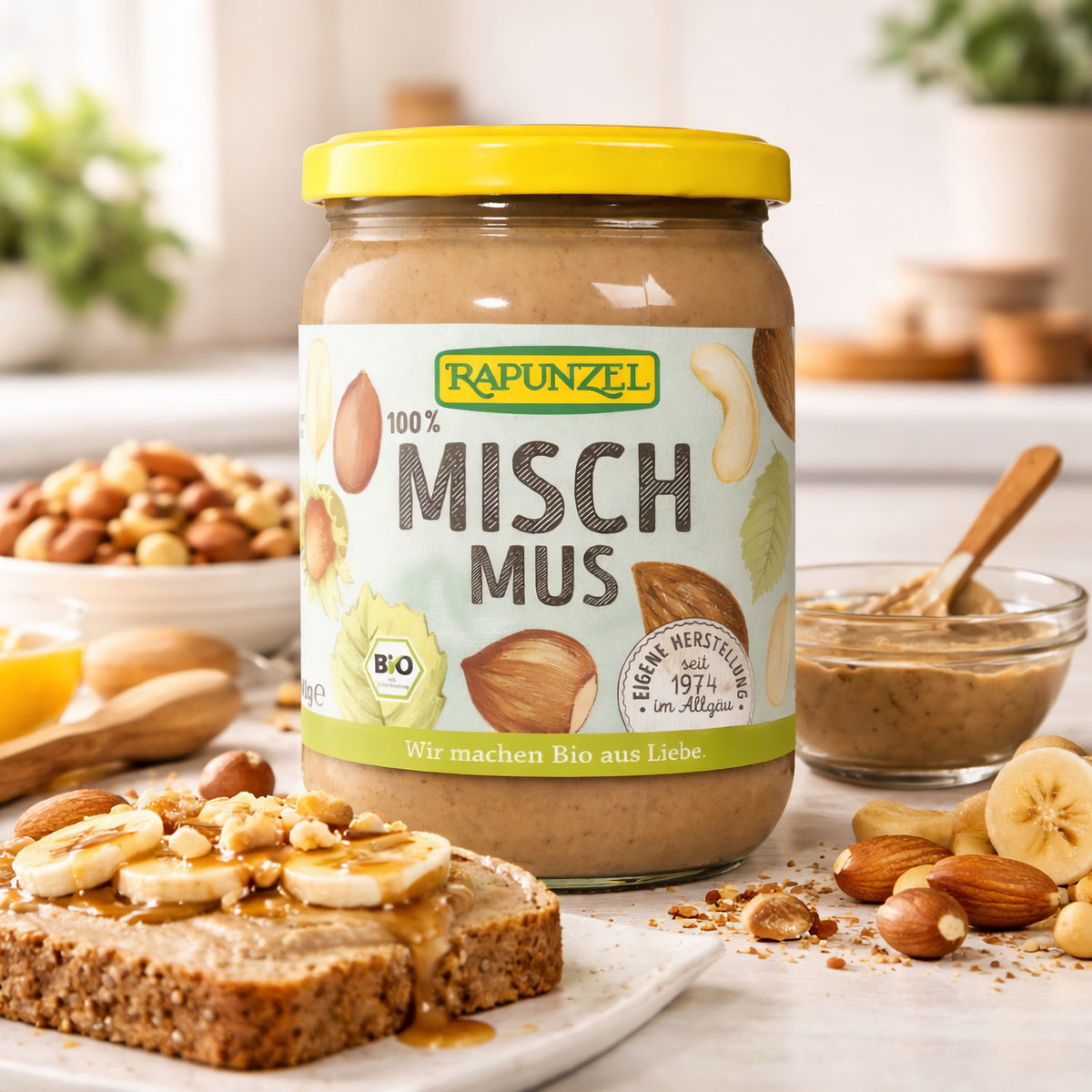 Bio Mischmus 4 Nüsse von Rapunzel, Kochmischung, zeigt eine Schale mit gemischten Nüssen und Bio-Label.