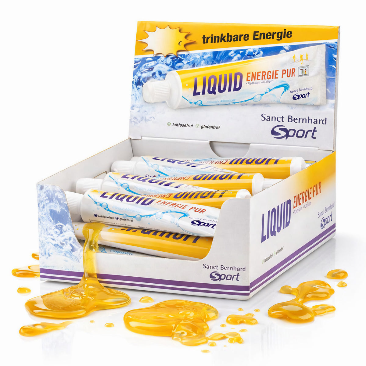 Offene Verpackung mit mehreren sanct bernhard sport liquid energie Tuben, eine Tube läuft aus, gelbe Flüssigkeit verteilt sich auf der Oberfläche.