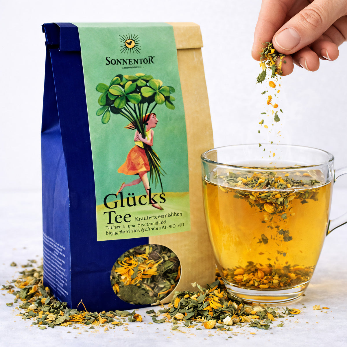 Bio Glücks Tee von Sonnentor, lose Teemischung in 50g Packung mit frischen, natürlichen Kräutern und Blumen.
