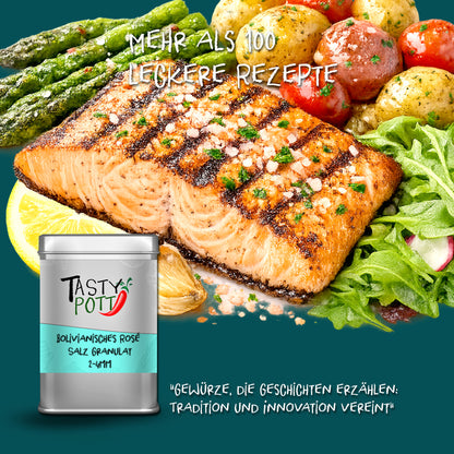 Gegrilltes Lachsfilet mit bolivianischem Rosé Salz Granulat von Tasty Pott bestreut, daneben Dose, Kartoffeln, Spargel und Salat.