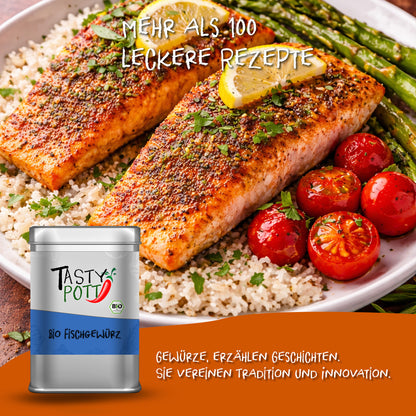 Serviervorschlag mit gewürztem Lachsfilet, Tomaten und Spargel auf Couscous, vorne die Tasty Pott Fischgewürz Dose.