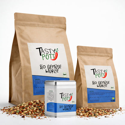 Tasty Pott Bio Gemüse Würze Gewürzmischung im braunen Nachfüllbeutel und in Dose, umgeben von bunter Gewürzmischung auf weißem Hintergrund.