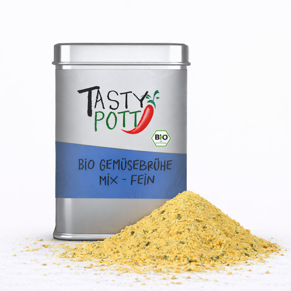 Tasty Pott Bio Gemüsebrühe in silberner Dose mit blauem Etikett, davor ein Häufchen gelbes Brühepulver auf weißem Untergrund.
