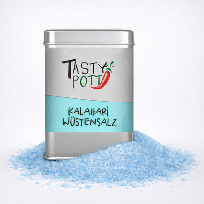 Tasty Pott Kalahari Wüstensalz 100g Dose auf weißem Hintergrund, umgeben von grobem, blauem Salzgranulat.