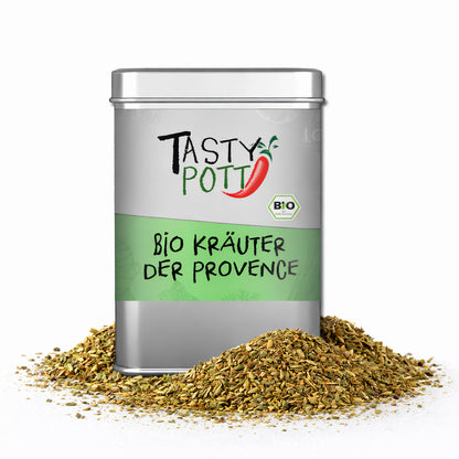 Tasty Pott Bio Kräuter der Provence Gewürzmischung in silberner Dose, umgeben von losem Kräuterstreu auf weißem Hintergrund.
