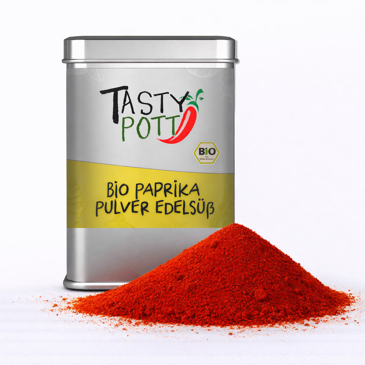 Dose Tasty Pott Bio Paprikapulver edelsüß 100g mit einem Haufen leuchtend rotem Paprikapulver davor auf weißem Hintergrund.