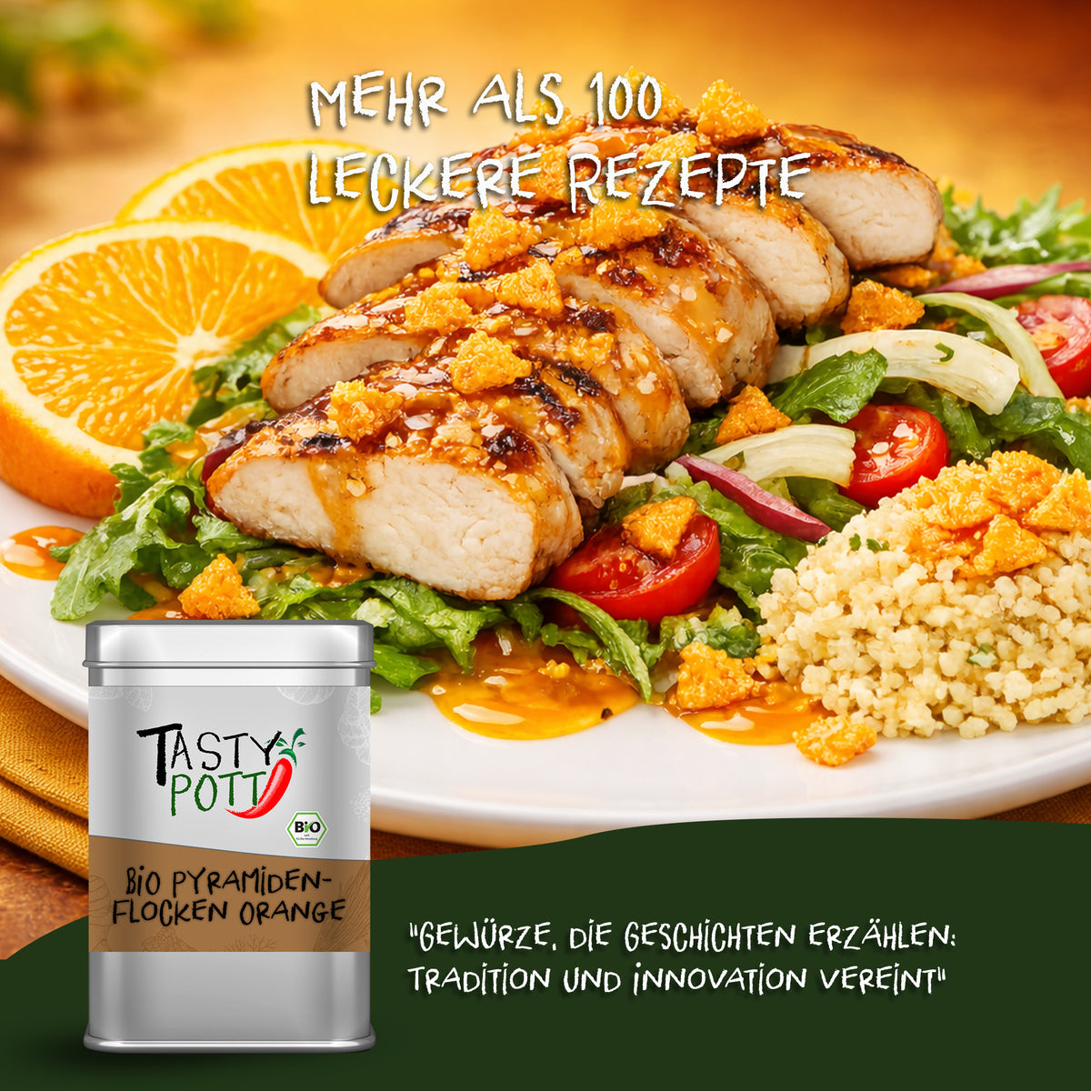 Gericht mit Hähnchen, Salat und Orangenscheiben, bestreut mit Tasty Pott Bio Pyramidenflocken Orange, Dose im Vordergrund.