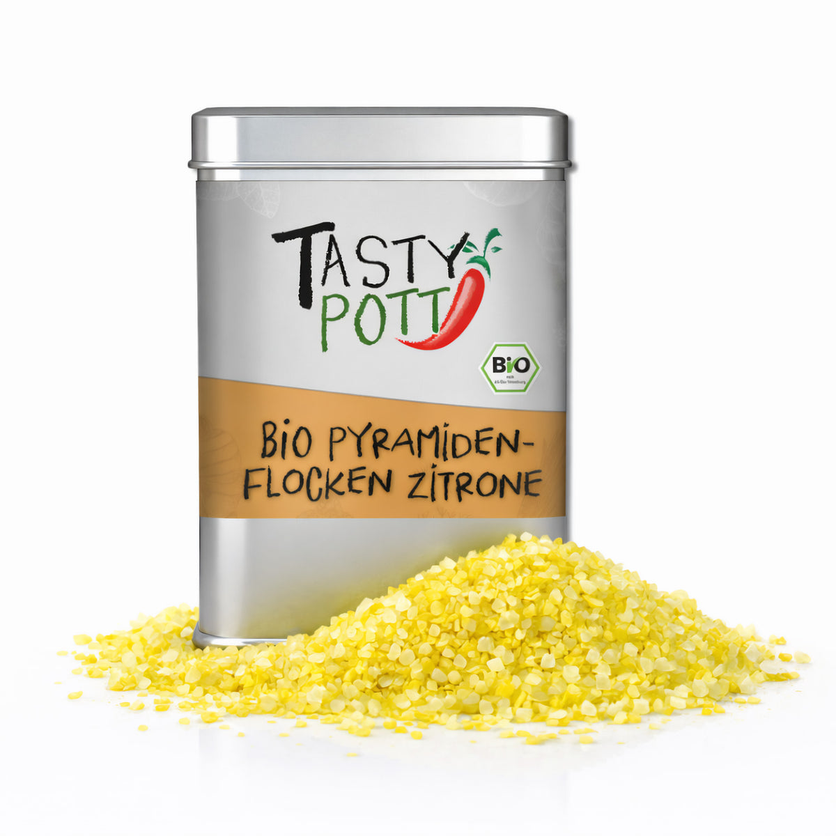 Silberne Tasty Pott Dose Bio Pyramidenflocken Zitrone mit gelben Salzflocken als Häufchen davor auf weißem Hintergrund.