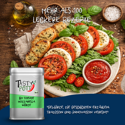 Tasty Pott Tomate Mozzarella Gewürz Dose vor einem Teller mit Tomate-Mozzarella-Salat, frischen Kräutern und Brot auf Holzuntergrund.