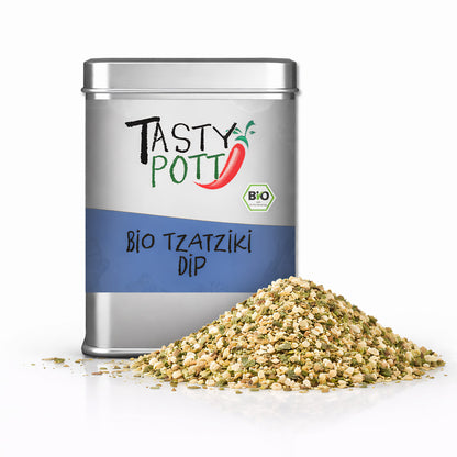 Tasty Pott Bio Tzatziki Gewürzmischung in silberner 100g Dose, daneben ein Haufen der trockenen Gewürze auf weißem Hintergrund.
