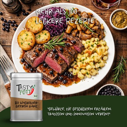 Teller mit Wildgericht, Kartoffeln, Rotkohl und Sauce, garniert mit ganzen Wacholderbeeren, daneben Tasty Pott Dose wacholderbeeren.