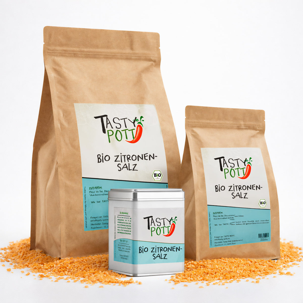 Drei Beutel und eine Dose Tasty Pott Bio Zitronensalz auf gelben Linsen, die Produktverpackungen sind von vorne sichtbar.