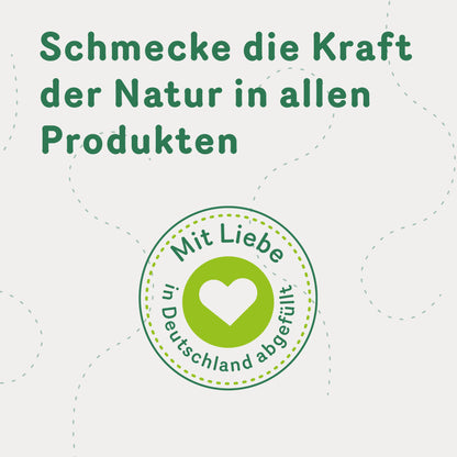 Siegel mit Herz und Text Mit Liebe in Deutschland abgefüllt, daneben Schriftzug über die Kraft der Natur in allen Tasty Pott trockenfrüchte.