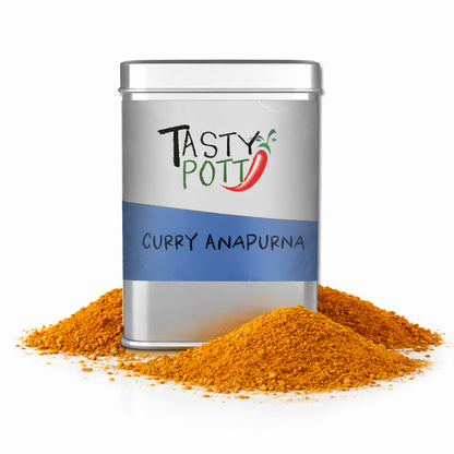 Tasty Pott Curry Anapurna Dose mit gelbem Currypulver, das in zwei Häufchen vor der Dose liegt.