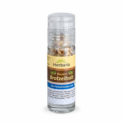 Herbaria Bauern Brotzeitsalz Mini-Mühle mit transparentem Kunststoffmahlwerk und Glaskorpus, gefüllt mit grober Bio-Gewürzmischung.
