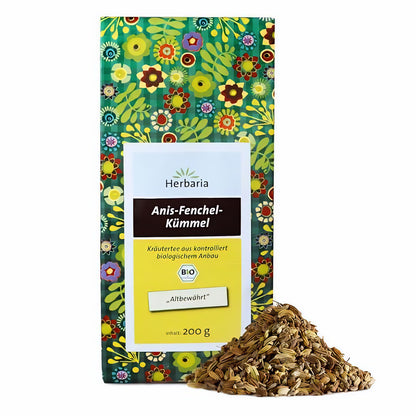 Herbaria Anis-Fenchel-Kümmel-Kräutertee in bunter 200g-Packung, vorne ein Haufen loser Teesamen.