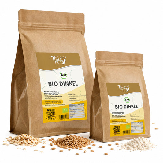 Zwei braune Beutel Tasty Pott Bio Dinkel mit sichtbaren Dinkelkörnern, Dinkelflocken und Dinkelmehl auf weißem Hintergrund.