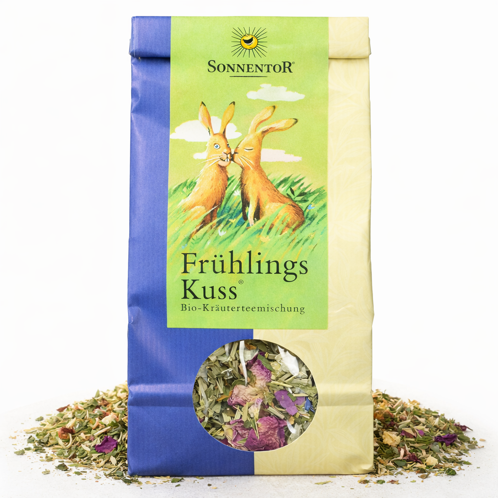 Lose Sonnentor FrühlingsKuss-Kräutertee in 80g, frischer Kräutertee mit blumigem Duft in einer offenen Teeverpackung.