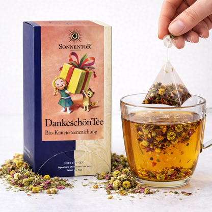 Bio Dankeschön Kräutertee von Sonnentor in Doppelkammerbeutel, frisch und aromatisch, sichtbar in der Packung.