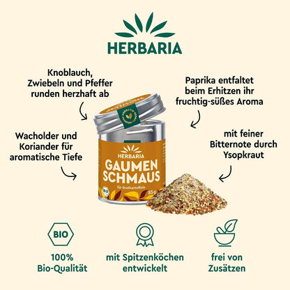Herbaria Gaumenschmaus Bratkartoffel-Gewürz vor einem Haufen bunter Gewürzmischung, umgeben von Zutatenhinweisen und Produktmerkmalen.
