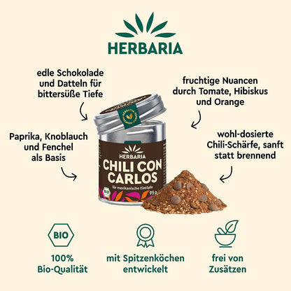 Herbaria Chili con Carlos Dose geöffnet, daneben ein Haufen der Gewürzmischung, umgeben von Zutaten- und Qualitätsangaben.