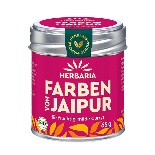 Herbaria Farben von Jaipur Curry-Gewürzmischung in pinkfarbener Dose mit gelbem Muster und 65g Angabe, Vorderseite sichtbar.