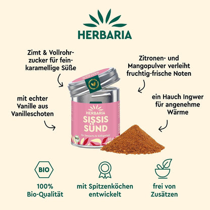 Herbaria Sissis Sünd Dose mit aufgeschütteter Gewürzmischung, umgeben von Texten zu Zutaten wie Zimt, Vanille, Ingwer und Mango.