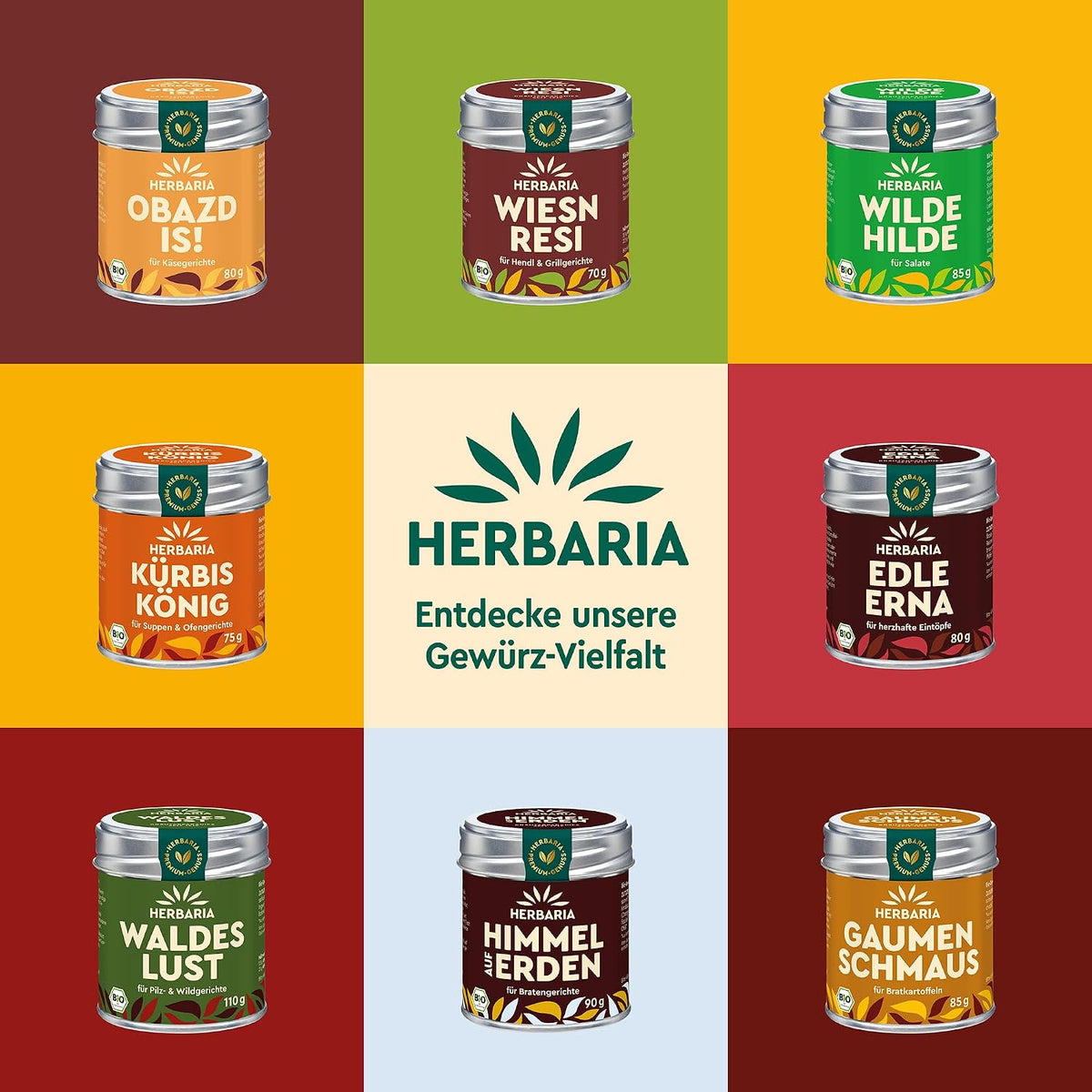 Neun verschiedene Herbaria Gewürzdosen, darunter Sissis Sünd, auf buntem Hintergrund, mittig das Herbaria Logo und der Hinweis auf Gewürz-Vielfalt.