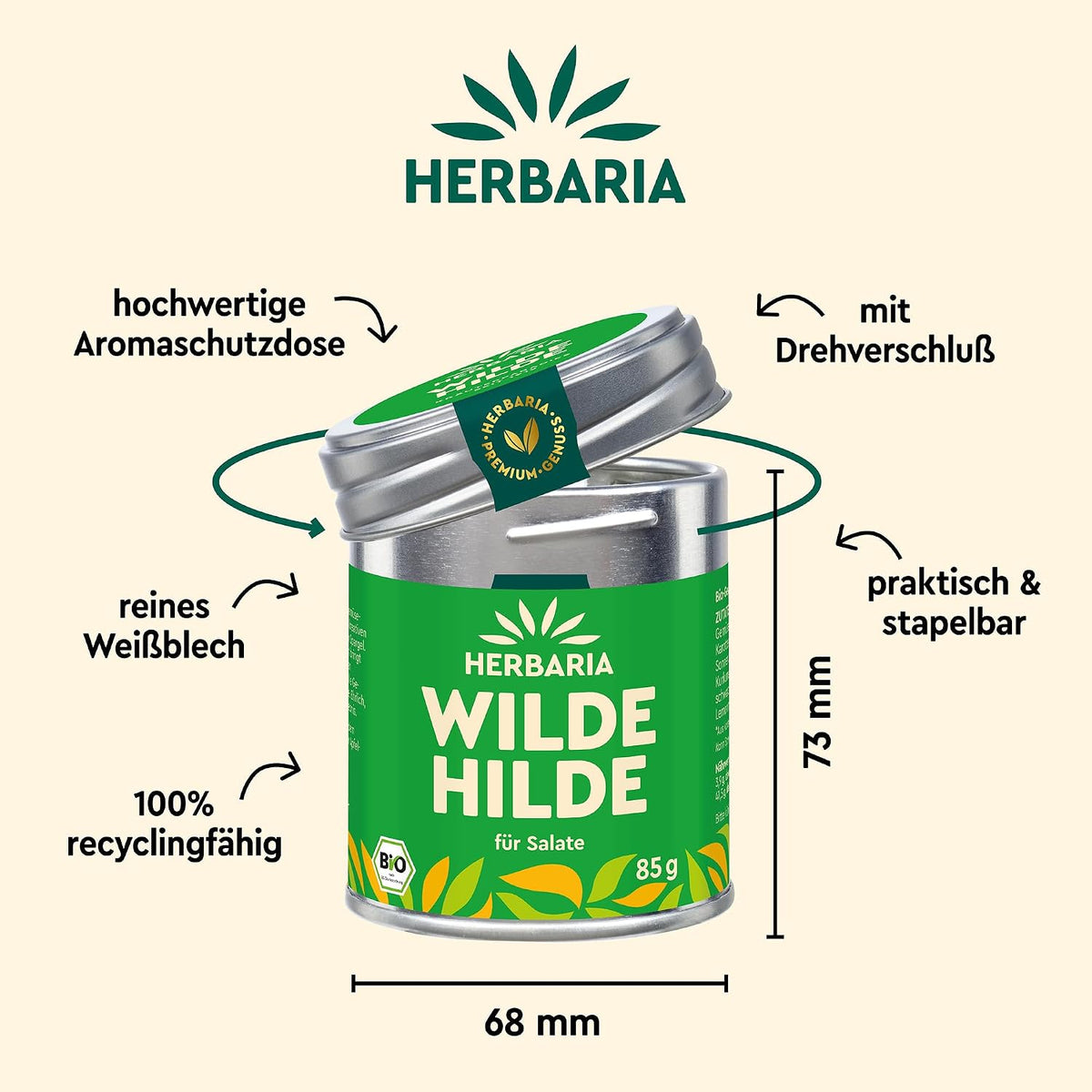 Herbaria Wilde Hilde Dose mit geöffnetem Deckel, umgeben von Pfeilen und Beschriftungen zu Material, Größe und Recyclingfähigkeit.